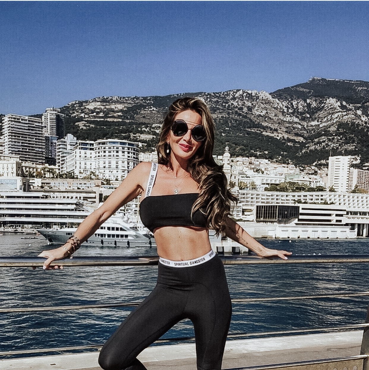 Ingrid De La Mare-Kenny in a yacht and wearing black sportswear 