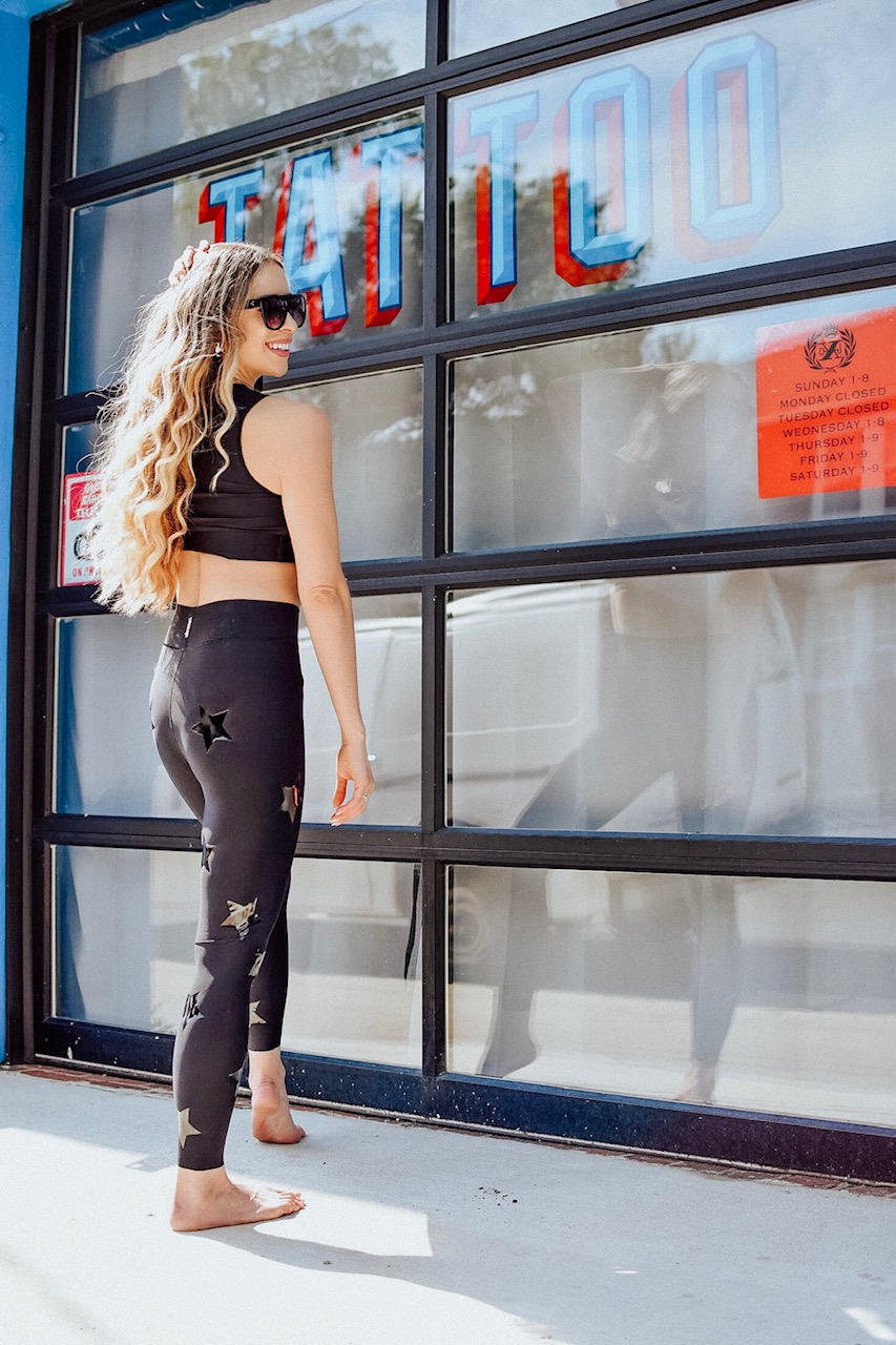 activewear brands you should be wearing, Stars on leggings and a slimming sports bra are ideal activewear